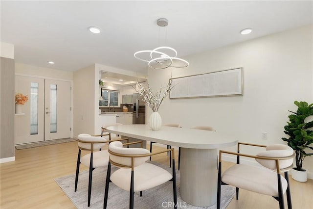 2405 Via Mariposa W Unit 1B, Laguna Woods, CA 92637 - dining space with light wood-style floors, french doors, baseboards, and recessed lighting