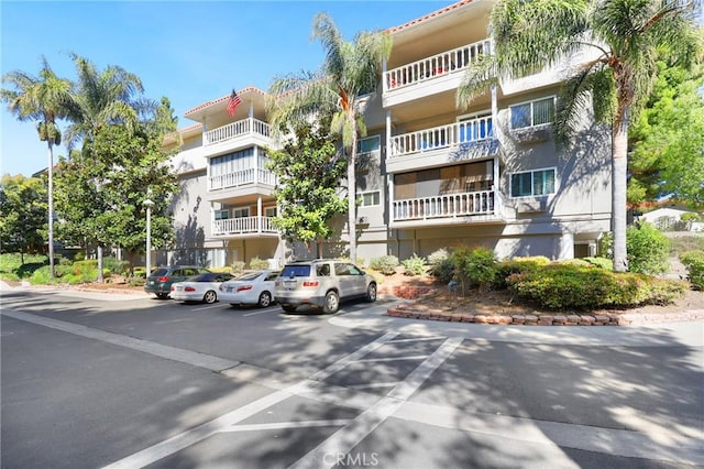 2405 Via Mariposa W Unit 1B, Laguna Woods, CA 92637 - view of apartment building / complex with uncovered parking