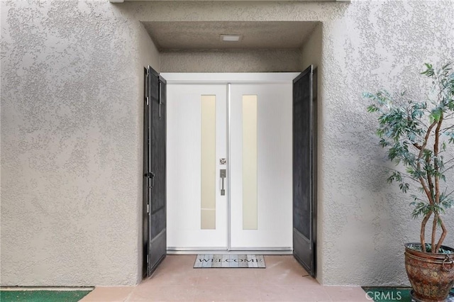 2405 Via Mariposa W Unit 1B, Laguna Woods, CA 92637 - entrance to property with stucco siding