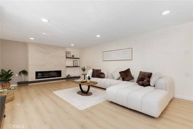 2405 Via Mariposa W Unit 1B, Laguna Woods, CA 92637 - living room featuring wood finished floors, recessed lighting, baseboards, and a high end fireplace
