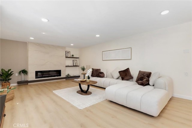 2405 Via Mariposa W Unit 1B, Laguna Woods, CA 92637 - living room with wood finished floors, recessed lighting, baseboards, and a high end fireplace