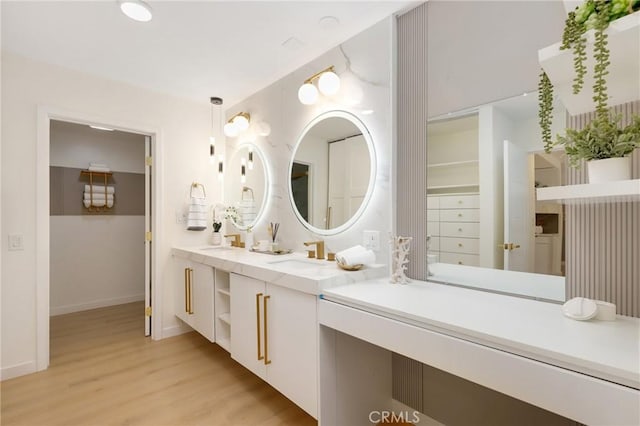 2405 Via Mariposa W Unit 1B, Laguna Woods, CA 92637 - bathroom with wood finished floors, baseboards, and double vanity