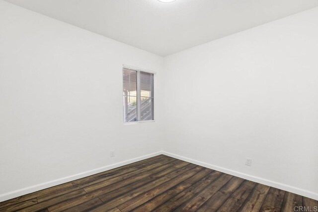 11365 Affinity Ct Unit 192, San Diego, CA 92131 - spare room with baseboards and dark wood-style flooring
