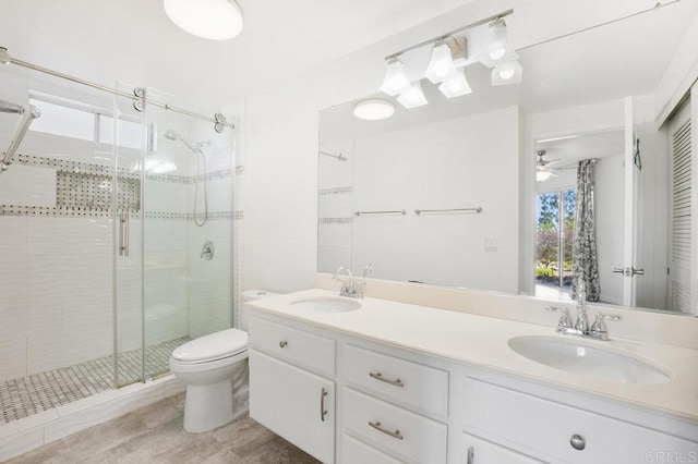 11365 Affinity Ct Unit 192, San Diego, CA 92131 - bathroom featuring a stall shower, double vanity, a ceiling fan, and tile patterned flooring