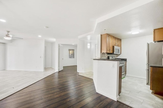 11365 Affinity Ct Unit 192, San Diego, CA 92131 - kitchen with appliances with stainless steel finishes, dark countertops, ceiling fan, open floor plan, and recessed lighting