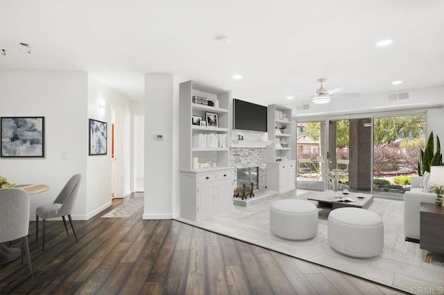 11365 Affinity Ct Unit 192, San Diego, CA 92131 - living room with wood finished floors, a tiled fireplace, a ceiling fan, and recessed lighting