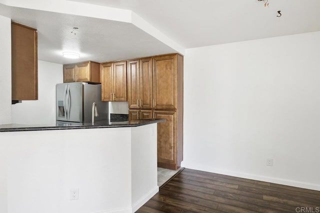 11365 Affinity Ct Unit 192, San Diego, CA 92131 - kitchen featuring stainless steel refrigerator with ice dispenser, dark wood finished floors, brown cabinets, and a peninsula