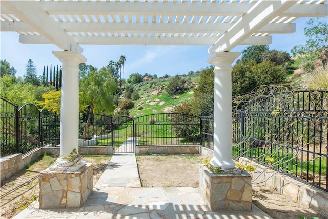 22751 Plummer St, Chatsworth, CA 91311 - view of patio / terrace with a pergola, a gate, and fence