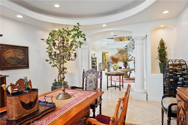 22751 Plummer St, Chatsworth, CA 91311 - dining space with decorative columns, arched walkways, a tray ceiling, and recessed lighting