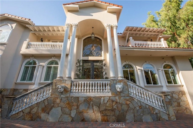 22751 Plummer St, Chatsworth, CA 91311 - exterior space featuring stone siding, a tile roof, and stucco siding