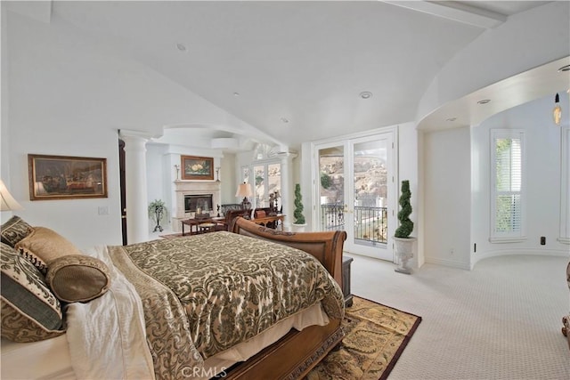 22751 Plummer St, Chatsworth, CA 91311 - bedroom featuring carpet flooring, access to outside, decorative columns, a glass covered fireplace, and vaulted ceiling