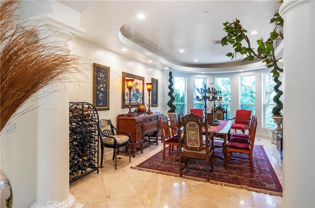 22751 Plummer St, Chatsworth, CA 91311 - dining room featuring a raised ceiling, recessed lighting, tile patterned floors, and ornate columns