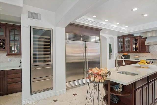 22751 Plummer St, Chatsworth, CA 91311 - kitchen featuring light countertops, a tray ceiling, stainless steel built in refrigerator, a sink, and visible vents