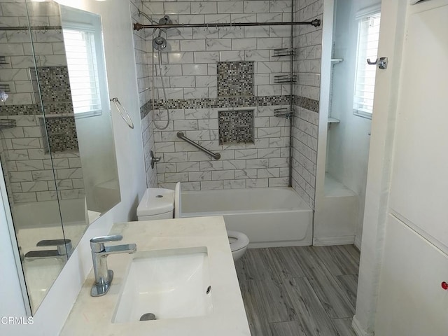 1420 S Butler Ave, Compton, CA 90221 - bathroom featuring washtub / shower combination, vanity, and wood finished floors