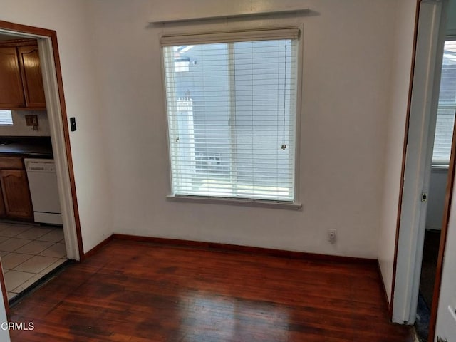 1420 S Butler Ave, Compton, CA 90221 - unfurnished dining area featuring plenty of natural light and dark wood-type flooring