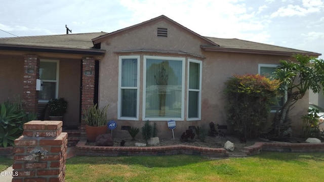 1420 S Butler Ave, Compton, CA 90221 - view of home's exterior featuring a yard, stucco siding, and a shingled roof