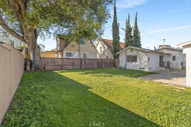 view of yard with a fenced backyard and a patio
