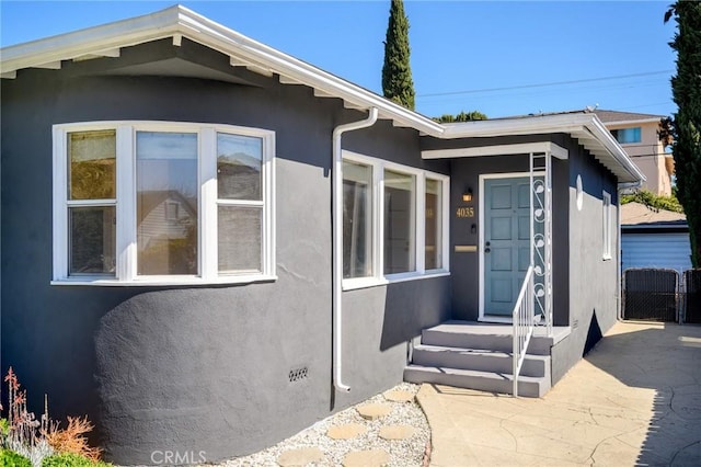exterior space with stucco siding