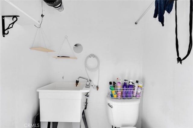 bathroom featuring toilet and a sink
