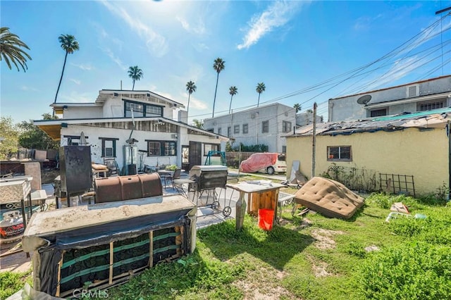 rear view of property with a patio area
