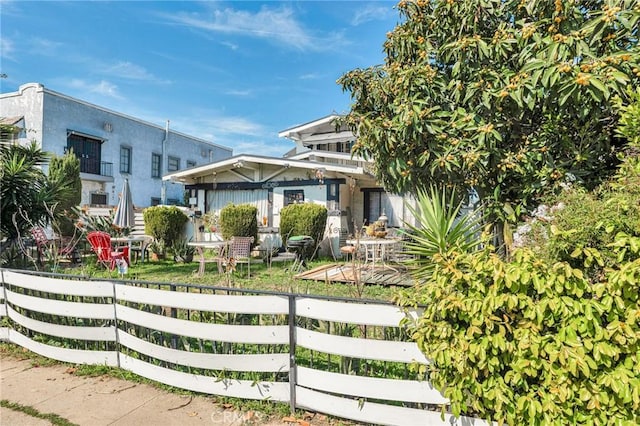 view of front of house with fence