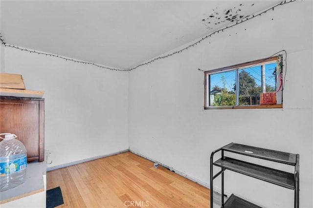 spare room featuring light wood-type flooring