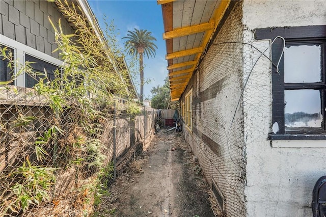 view of property exterior featuring fence