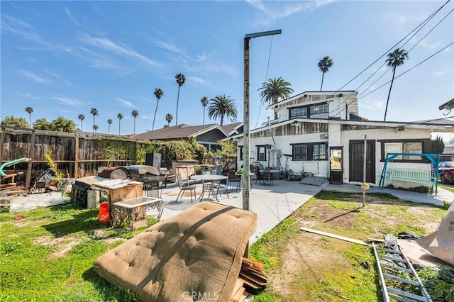 exterior space with fence and a patio