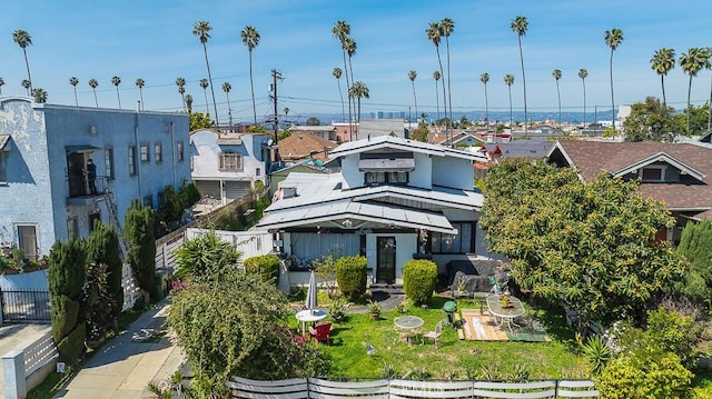 rear view of property featuring fence
