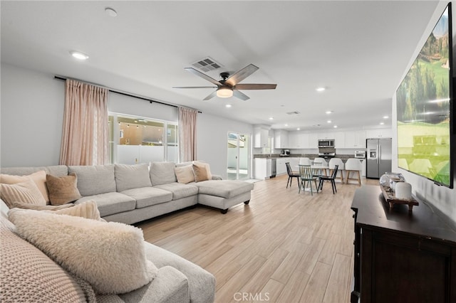 1772 Old Wagon Dr, Hemet, CA 92545 - living room featuring light wood-style flooring, visible vents, recessed lighting, and a ceiling fan