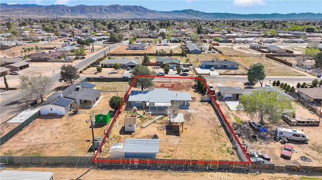 drone / aerial view featuring a mountain view and a residential view