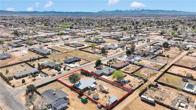 birds eye view of property with a mountain view