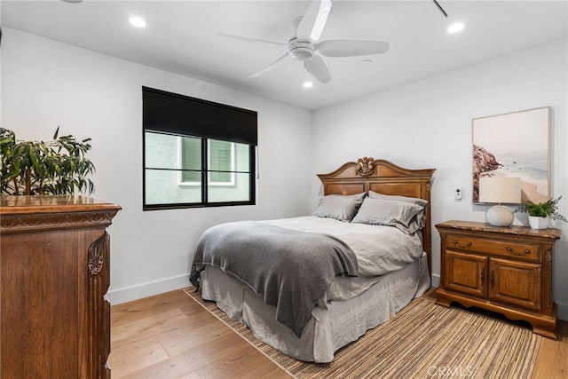 bedroom with light wood-type flooring, baseboards, recessed lighting, and ceiling fan