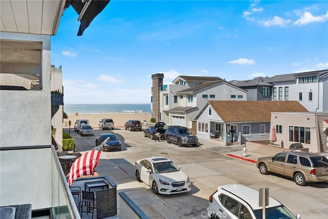 exterior space with sidewalks and a water view