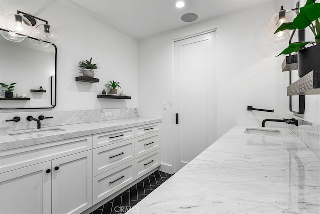 bathroom featuring vanity and recessed lighting
