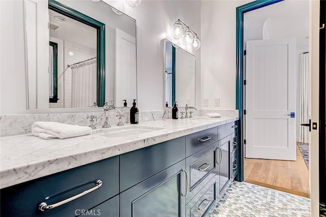 528 15th St, Manhattan Beach, CA 90266 - full bath with double vanity, a sink, visible vents, and wood finished floors