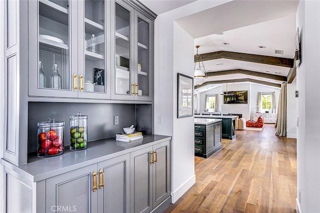 528 15th St, Manhattan Beach, CA 90266 - bar featuring vaulted ceiling with beams, baseboards, light wood finished floors, and visible vents
