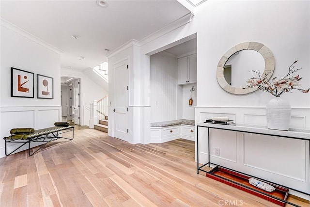 528 15th St, Manhattan Beach, CA 90266 - hall featuring stairs, a decorative wall, light wood-style flooring, and ornamental molding