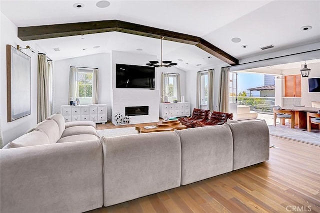 528 15th St, Manhattan Beach, CA 90266 - living area featuring light wood-style flooring, vaulted ceiling with beams, a glass covered fireplace, and visible vents