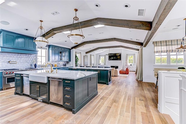 528 15th St, Manhattan Beach, CA 90266 - kitchen featuring tasteful backsplash, stainless steel appliances, a sink, visible vents, and vaulted ceiling with beams