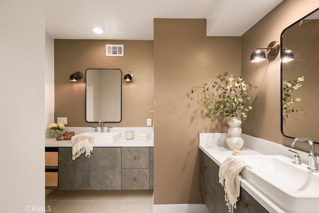 bathroom featuring tile patterned floors, vanity, and visible vents
