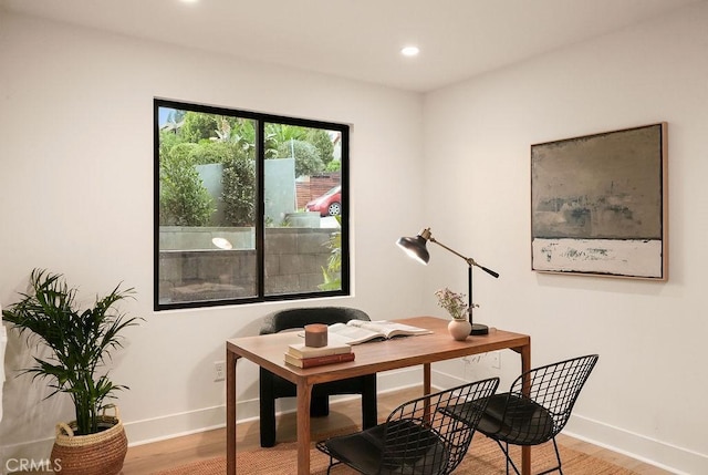 office space with light wood-style floors, baseboards, and recessed lighting