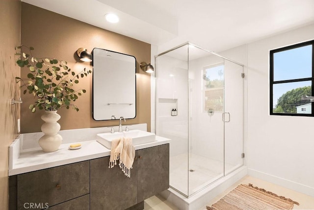bathroom featuring a shower stall and vanity