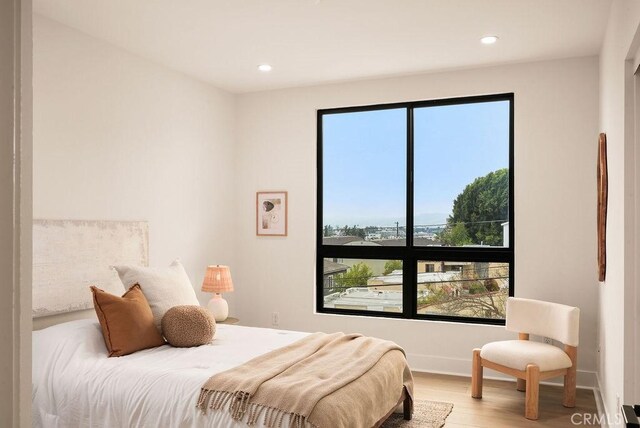 1315 W Cannon Dr, Los Angeles, CA 90026 - bedroom with wood finished floors, multiple windows, and recessed lighting