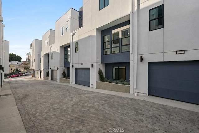 1315 W Cannon Dr, Los Angeles, CA 90026 - exterior space featuring a residential view, driveway, and an attached garage