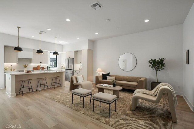 1315 W Cannon Dr, Los Angeles, CA 90026 - living area with visible vents, light wood-type flooring, and recessed lighting
