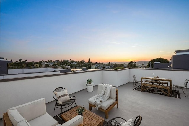 1315 W Cannon Dr, Los Angeles, CA 90026 - patio terrace at dusk featuring outdoor dining area, an outdoor hangout area, and a balcony