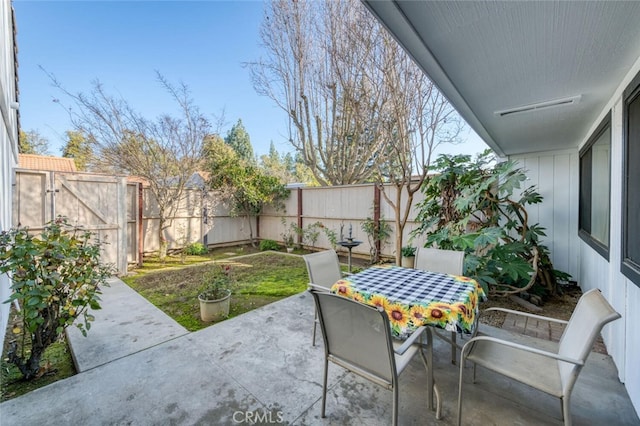4837 N Hulbert Ave, Fresno, CA 93705 - fenced backyard featuring a patio and outdoor dining space