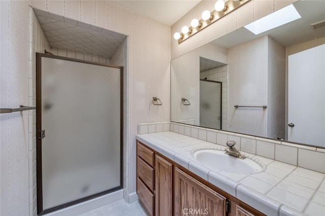 4837 N Hulbert Ave, Fresno, CA 93705 - full bath with vanity, a stall shower, and tile patterned flooring