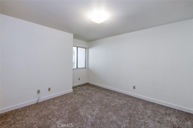 4837 N Hulbert Ave, Fresno, CA 93705 - empty room with carpet flooring and baseboards
